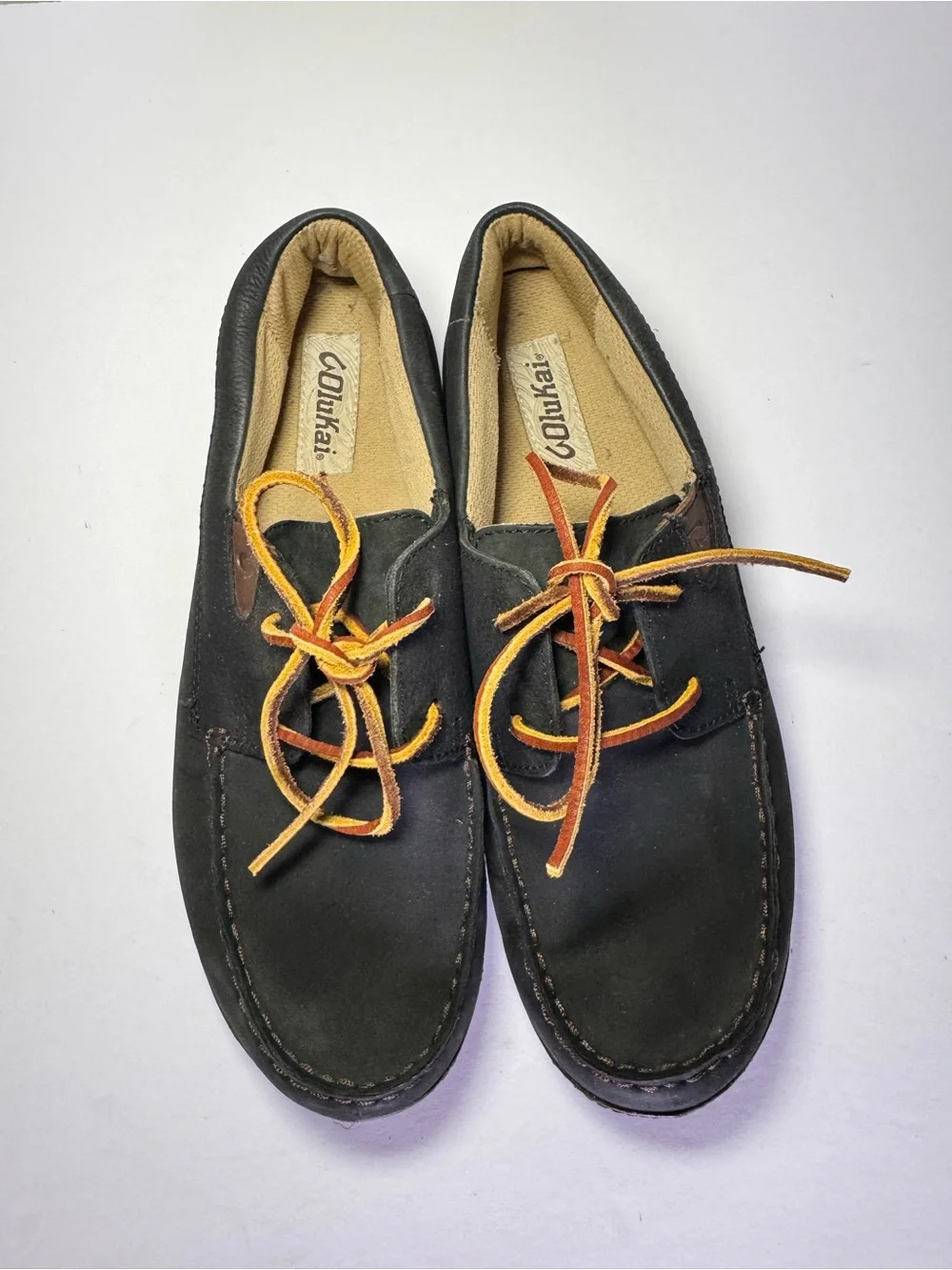 OluKai Black and Brown Leather Boat Moccasins with Tan Laces